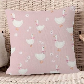 A Cute White Goose-Themed Pillow for a Room with a Fun Daisy Print Cover